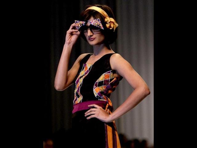 A Pakistani model presents a creation by designer Ayesha Ibrahim, on the second and last day of Fashion Pakistan Week, in Karachi. (AP Photo)