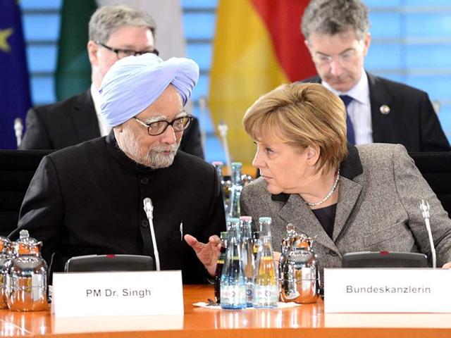Prime Minister Manmohan Singh and German Chancellor Angela Merkel chat before leading the Indo-German inter-governmental consultations with cabinet and delegation members at the Chancellery in Berlin. AFP photo
