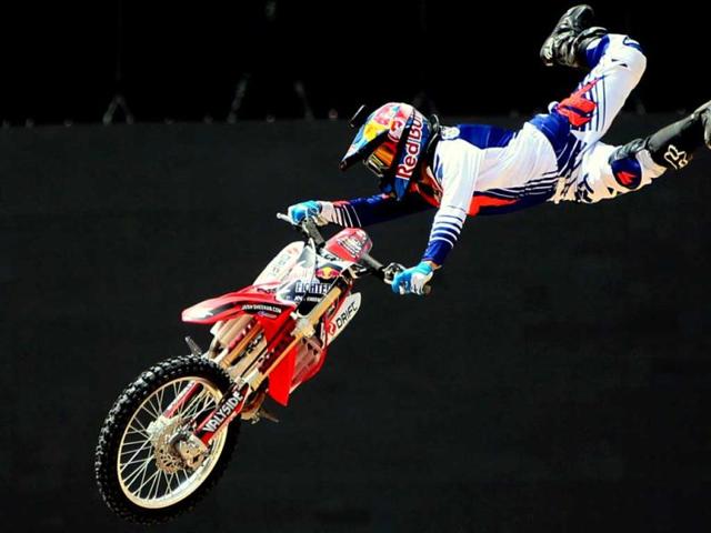 A motocross rider shows his skills during a training session on the eve of the 2013 Red Bull X-Fighters World Tour in the Gulf emirate of Dubai. AFP