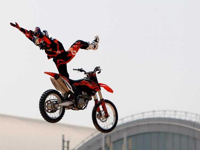 A motocross rider shows his skills during a training session on the eve of the 2013 Red Bull X-Fighters World Tour in the Gulf emirate of Dubai. AFP