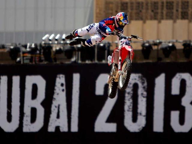 A motocross rider shows his skills during a training session on the eve of the 2013 Red Bull X-Fighters World Tour in the Gulf emirate of Dubai. AFP