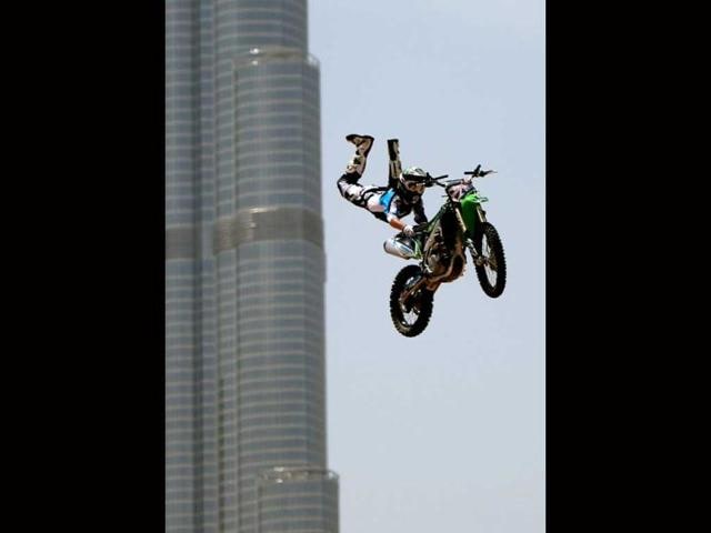 A motocross rider shows his skills during a training session on the eve of the 2013 Red Bull X-Fighters World Tour in the Gulf emirate of Dubai. AFP