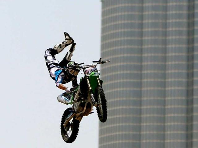 A motocross rider shows his skills during a training session on the eve of the 2013 Red Bull X-Fighters World Tour in the Gulf emirate of Dubai. AFP