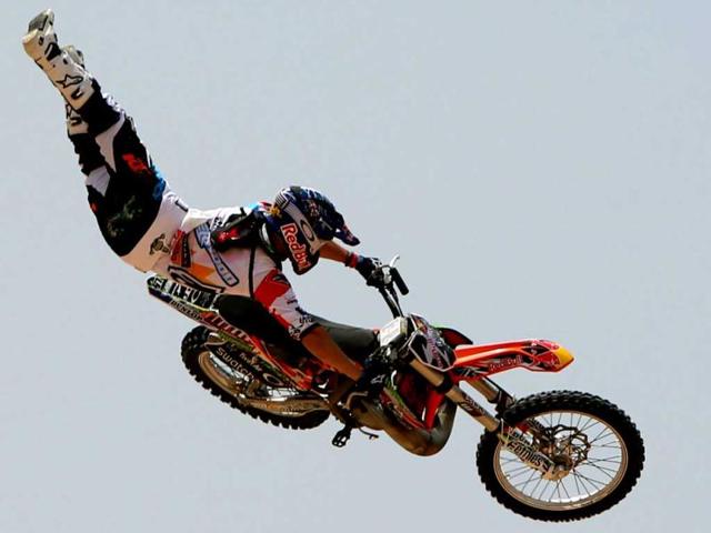 A motocross rider shows his skills during a training session on the eve of the 2013 Red Bull X-Fighters World Tour in the Gulf emirate of Dubai. AFP
