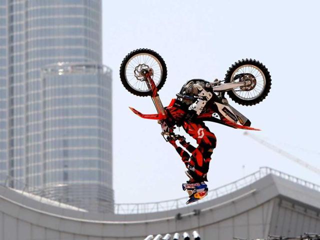 A motocross rider shows his skills during a training session on the eve of the 2013 Red Bull X-Fighters World Tour in the Gulf emirate of Dubai. AFP