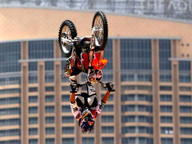 A motocross rider shows his skills during a training session on the eve of the 2013 Red Bull X-Fighters World Tour in the Gulf emirate of Dubai. AFP