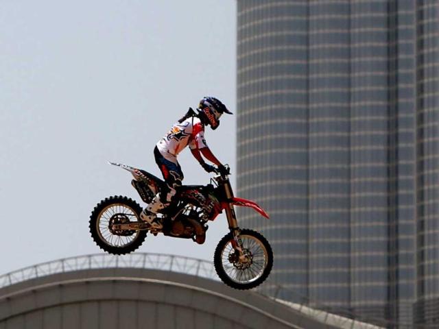 A motocross rider shows his skills during a training session on the eve of the 2013 Red Bull X-Fighters World Tour in the Gulf emirate of Dubai. AFP