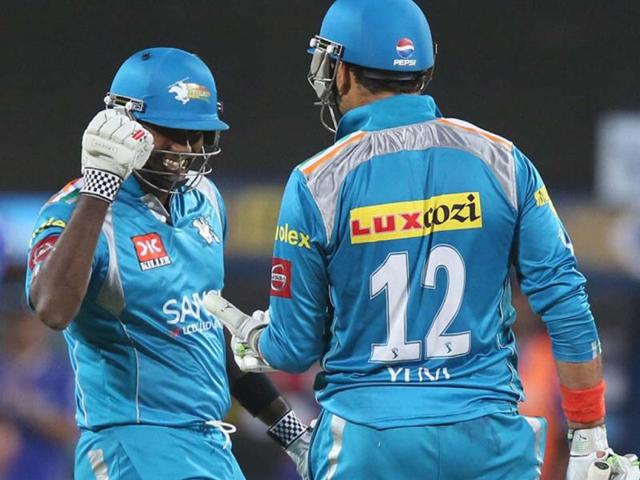 Pune Warriors captain Angelo Matthews greets Yuvraj Singh after winning against Rajasthan Royals during the T20 match in Pune. PTI Photo