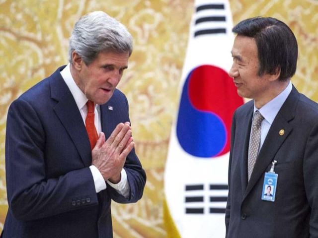 US secretary of state gestures as he meets South Korea's foreign minister Yun Byung-se before the arrival of South Korean's President Park Geun-hye at the presidential Blue House in Seoul. AP/Paul Richard, Pool