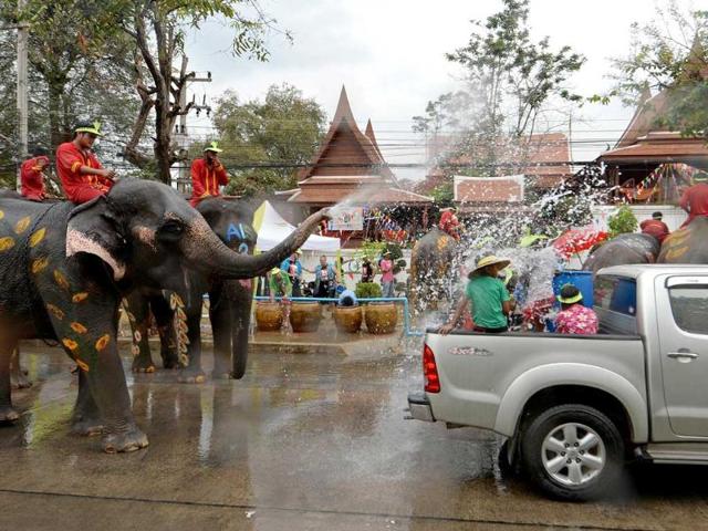 Thai villagers take part in a water battle with elephants as they join celebrations marking the Songkran Festival in Ayutthaya province. Songkran is the Thai New Year. AFP