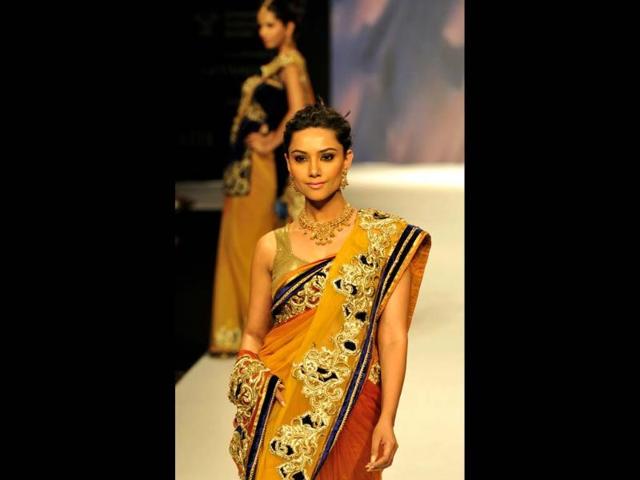 A model displays jewellery at the Gem and Jewellery Fair at Pragati Maidan in New Delhi. HT Photo/Vipin Kumar