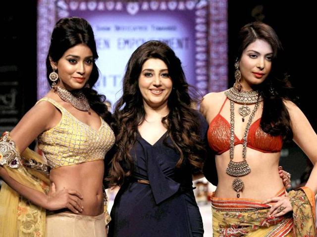 Actress Shriya Saran, the designer and a model at India International Jewellery Week IIJW in New Delhi. PTI Photo
