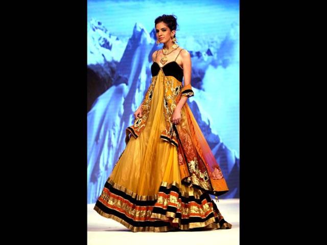 A model walks the ramp at Delhi's first edition of India International Jewellery Week. PTI Photo