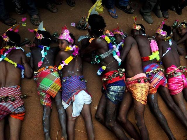 Devotees perform rituals with human remains during the Shiva Gajan festival in Kurmun in Kolkata. AFP