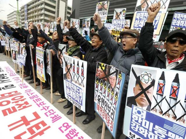 Anti-North Korean protesters from conservative, right-wing and pro-U.S. civic groups, chant slogans during a protest in central Seoul. North Korea celebrated the 101st anniversary of its founder's birth with flowers on Monday, although there was no sign of tension easing as South Korea warned that the North's survival could be in question without change and development. (Reuters)