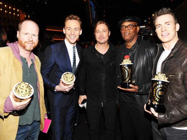 Actor Brad Pitt, center, and from left, director Joss Whedon, actors Tom Hiddleston, Samuel L. Jackson and Chris Evans, from the cast of The Avengers, winner of the award for movie of the year, pose backstage at the MTV Movie Awards in Sony Pictures Studio Lot in Culver City, Calif., on Sunday April 14, 2013. (MTV/AP Images)
