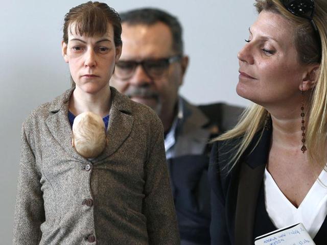 People look at a sculpture by Australian artist Ron Mueck exhibited at the Fondation Cartier in Paris. (AFP Photo)