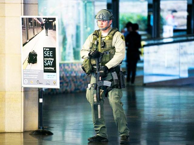 A Los Angeles Sheriffs Counter Terrorism Unit officer carries an AR-15 assault rifle, as he patrols the entrance to Union Station in Los Angeles. The city increased security following bomb explosions in Boston that killed two people and injured more than 80 near the crowded finish line of the Boston Marathon. AP Photo