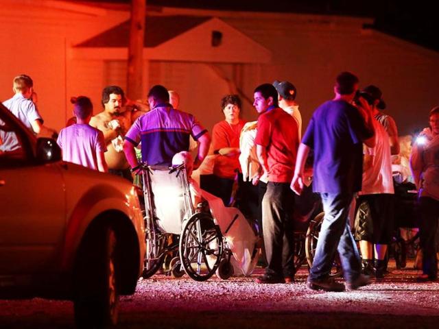 Elderly persons from a nearby nursing home are triaged in a parking lot before being moved to a school stadium following a fertilizer plant explosion in West, Texas. AP photo
