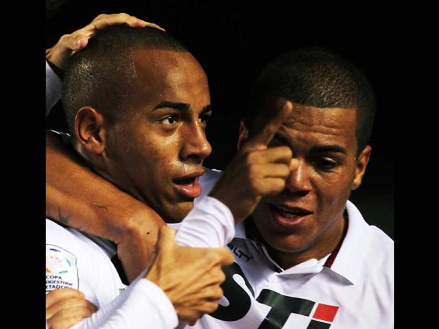 Ademilson of Brazil's Sao Paulo celebrates with teammate Thiago Carleto after scoring against Brazil's Atletico MG during their Copa Libertadores soccer match in Sao Paulo. (Reuters)