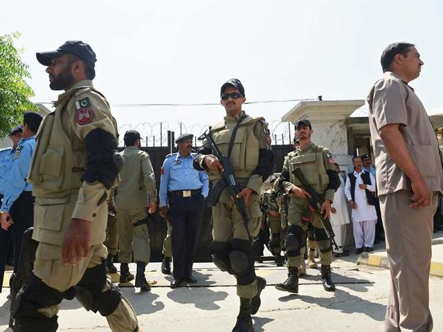 Pakistani paramilitary soldiers leave from the high court after the case hearing of former military ruler Pervez Musharraf in Islamabad. AFP