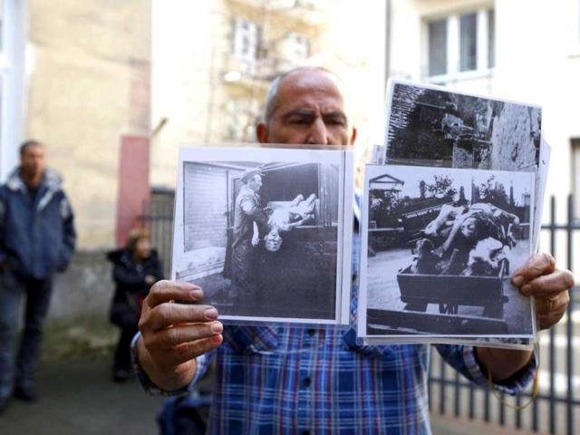A guide presents images from the Warsaw Ghetto during the Second World War to an Israeli group visiting places of the former Jewish Ghetto in Warsaw. The 70th anniversary of the Warsaw Ghetto Uprising is being commemorated today. Reuters