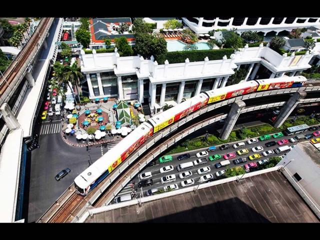 A Skytrain passes over vehicles on the road in Bangkok. BTS Group Holdings PCL's infrastructure fund rose as much as 22 percent in its trading debut as Thailand's biggest initial public offering underscored demand from yield-hungry investors amid a flurry of listings in Southeast Asia. Reuters