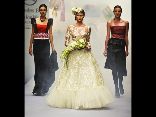 A model displays a wedding dress of Mexican designer Lydia Lavin during the autumn-winter Fashion Week edition in Mexico city. AFP