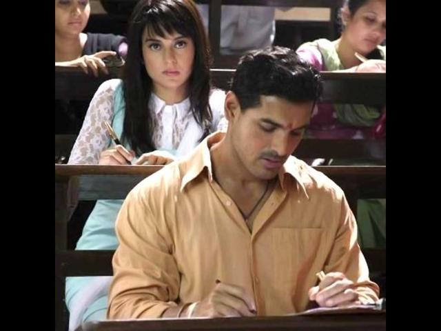 Contrary to his projected role of a gangster in the film, John Abraham looks rather innocent in this still along with Kangana Ranaut.
