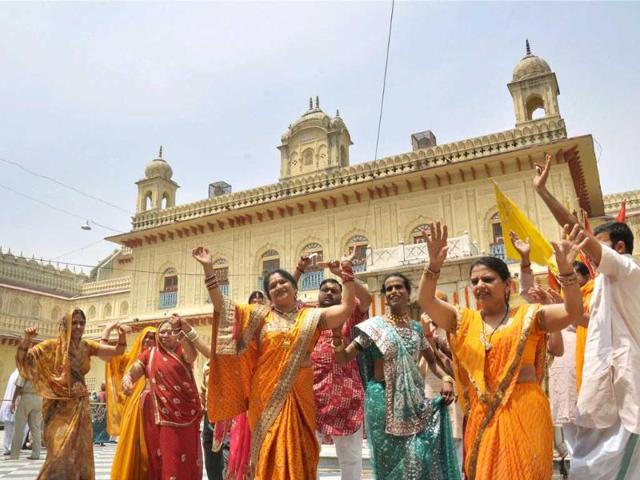 Devotees dance at Kanak Bhavan as they celebrate Ram Navami festival in Ayodhya. PTI