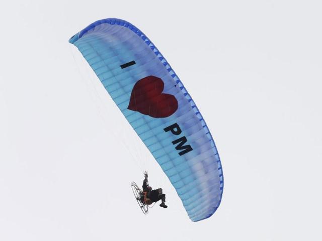 A paraglider sails past showing support for Malaysia's Prime Minister Najib Razak, as Najib arrives to submit his nomination papers to contest in Pekan constituency for the upcoming general elections in Pekan. (Reuters)