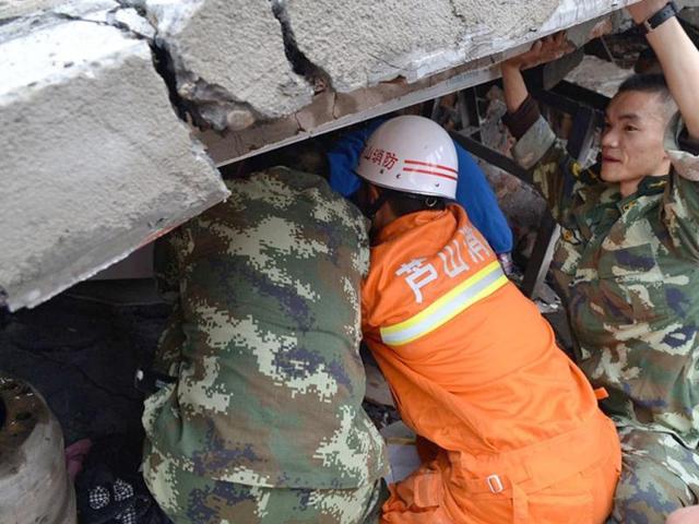 Rescuers gather after an earthquake hit Ya'an City in Lushan county, southwest China's Sichuan province. AFP