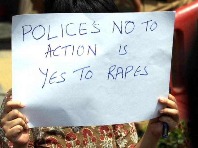 An-anti-rape-protester-displays-a-placard-during-a-protest-against-the-Delhi-Police-over-the-recent-rape-of-a-minor-girl-at-police-headqaurters-in-New-Delhi-PTI