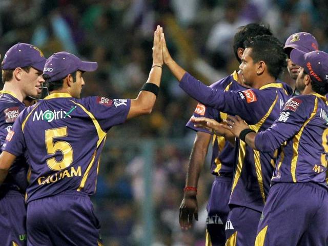 KKR bowler Sunil Narine celebrates with teammate after dismissing Chennai Super Kings batsman R Ashwin during their T20 match in Kolkata. PTI