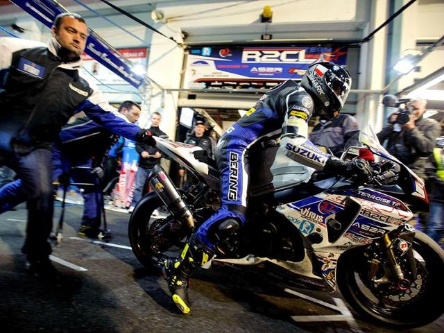 A racer leaves the pit stop at the Magny-Cours racetrack in Magny-Cours, central France, during the 77th Bol d'Or 24-hour motorbike race. AFP