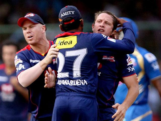 Delhi Daredevils cricketers celebrate the dismissal of Mumbai Indians batsman Dwayne Smith during the T20 League match in New Delhi. PTI
