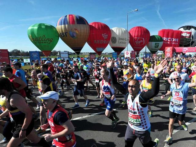Runners take part in the 2013 London Marathon in southeast London. AFP Photo