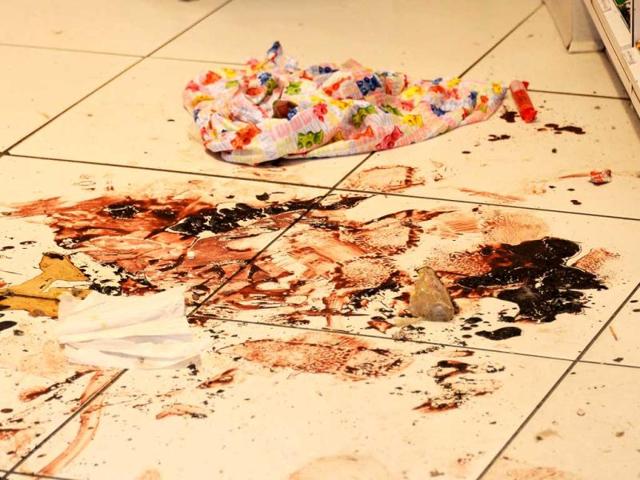 Dried blood trails are still visible inside the Sugar Heavan store near the finish line of the Boston Marathon in Boston, Massachusetts. (AFP Photo)