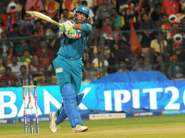 Pune Warriors India's Yuvraj Singh plays a shot during their T20 match against Royal Challengers Bangalore at Chinnaswamy Stadium in Bangalore. (UNI)