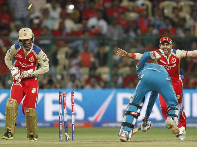 Pune Warriors India's Ishwar Chand Pandey bowled out by RCB's Chris Gayle during T20 match in Bangalore. (Sanjeev Verma/HT)