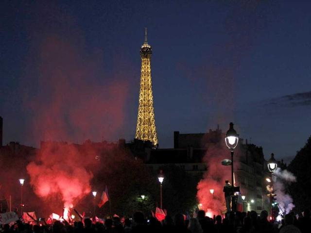 Anti-gay marriage activists hold smoke flares during a demonstration in Paris. (AP Photo)