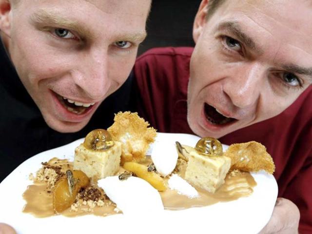 French Michelin-starred Chef David Faure and his assistant Geoffroy Szamburski pose behind a dessert "Inclusion de grillons en bubble au whisky" in the kitchen of their restaurant "Aphrodite", in Nice, southeastern France. Chef David Faure proposed dishes composed with worms and crickets. (AFP)