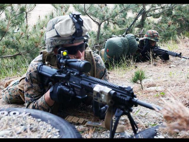 US Marines aim on target during the US-South Korea joint military exercises called Ssangyong 2013 as part of their two-month-long Foal Eagle military exercises in Pohang, south of Seoul, South Korea. AP Photo