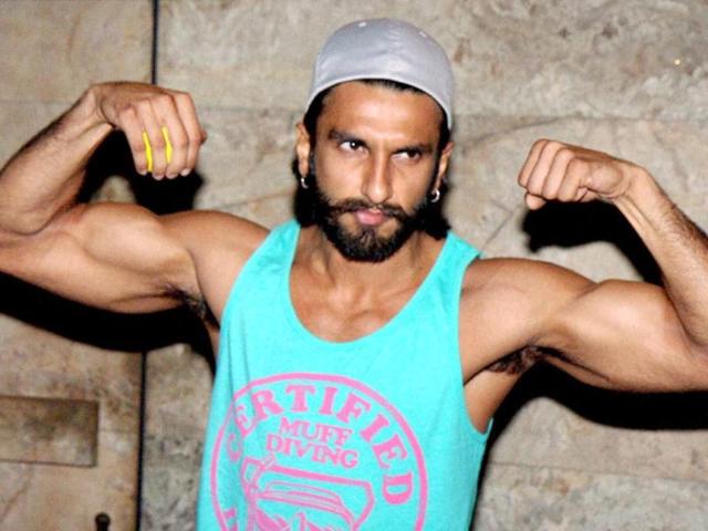 Ranveer Singh flexes some muscle (we're not sure why!) at the Bombay Talkies premiere. (PTI Photo)