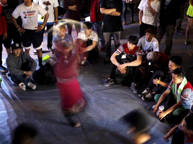 A dancer warms up before performing at the 2013 B-BOY Shanghai breakdancing competition in Shanghai. Reuters