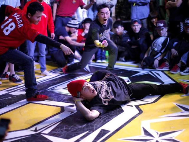 A dancer performs during the 2013 B-BOY Shanghai breakdancing competition in Shanghai. Reuters