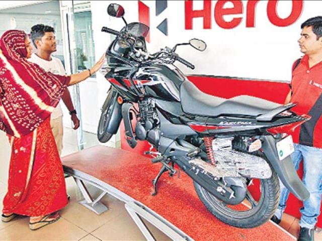 Customers-at-a-Hero-showroom-in-Ahmedabad-Photo-PTI Customers-at-a-Hero-showroom-in-Ahmedabad-Photo-PTI