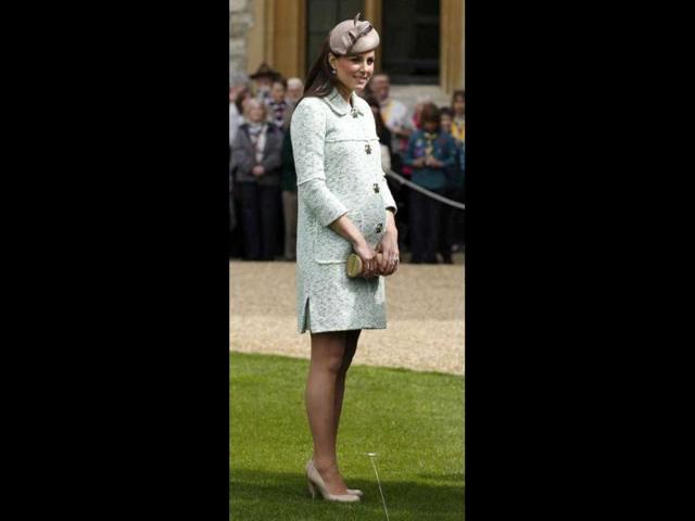 Stylish from head to toe: Duchess Kate wears a beautifully sober hat that she teams with a pale green dress and her favourite nude shoes at the National Review of Queen's Scouts at Windsor Castle in Berkshire. (AFP Photo)
