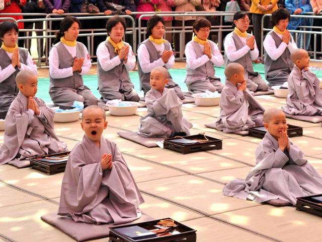 Young South Korean Buddhists attend a ceremony called "children becoming Buddhist monks" at Chogye Temple ahead of Buddha's birthday in central Seoul. AFP