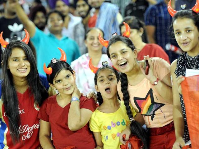 Fans enjoying the T20 cricket match between Kings XI Punjab and Royal Challengers Bangalore at PCA Stadium, in Mohali. HT Photo/Gurpreet Singh